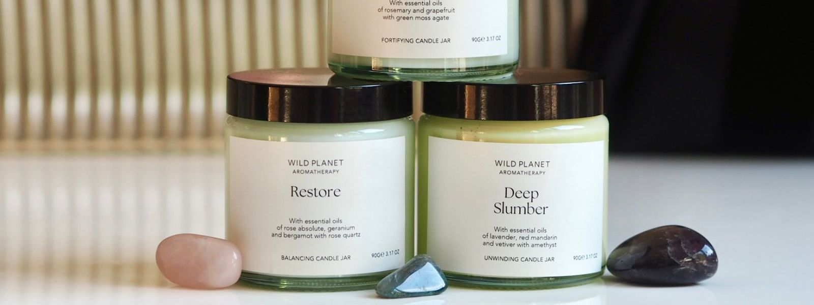 Three candle jars with crystals by Wild Planet Aromatherapy