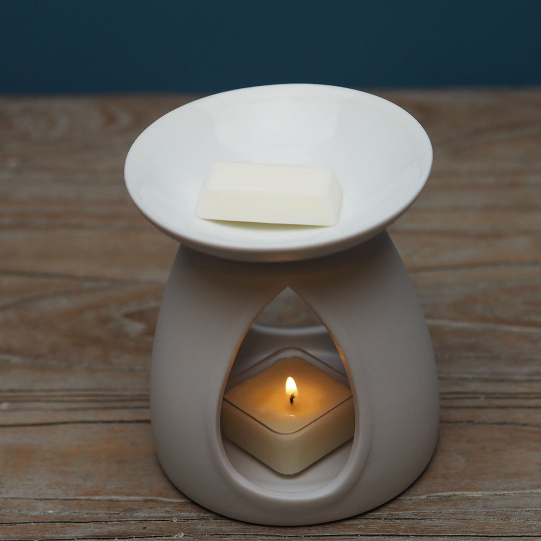 Matt white large Oil Burner Wax Melter with tea light on wooden table by Wild Planet Aromatherapy