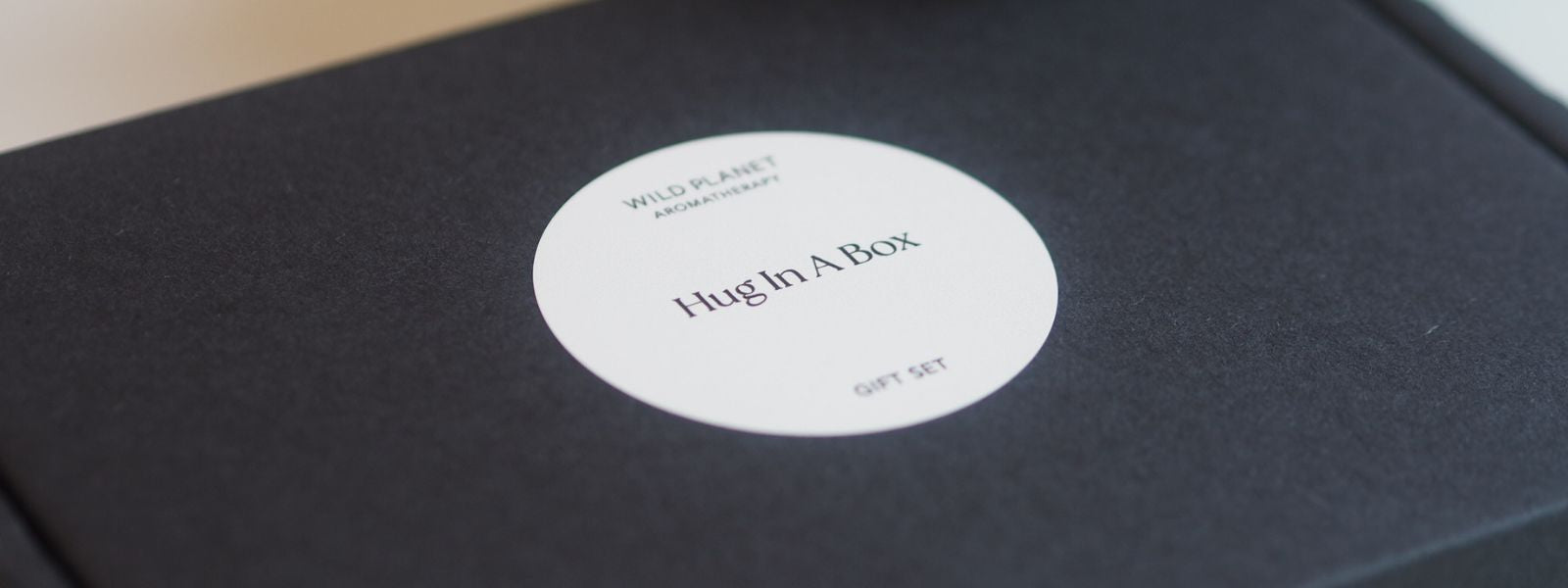 Hug In A Box letterbox black gift set by Wild Planet Aromatherapy