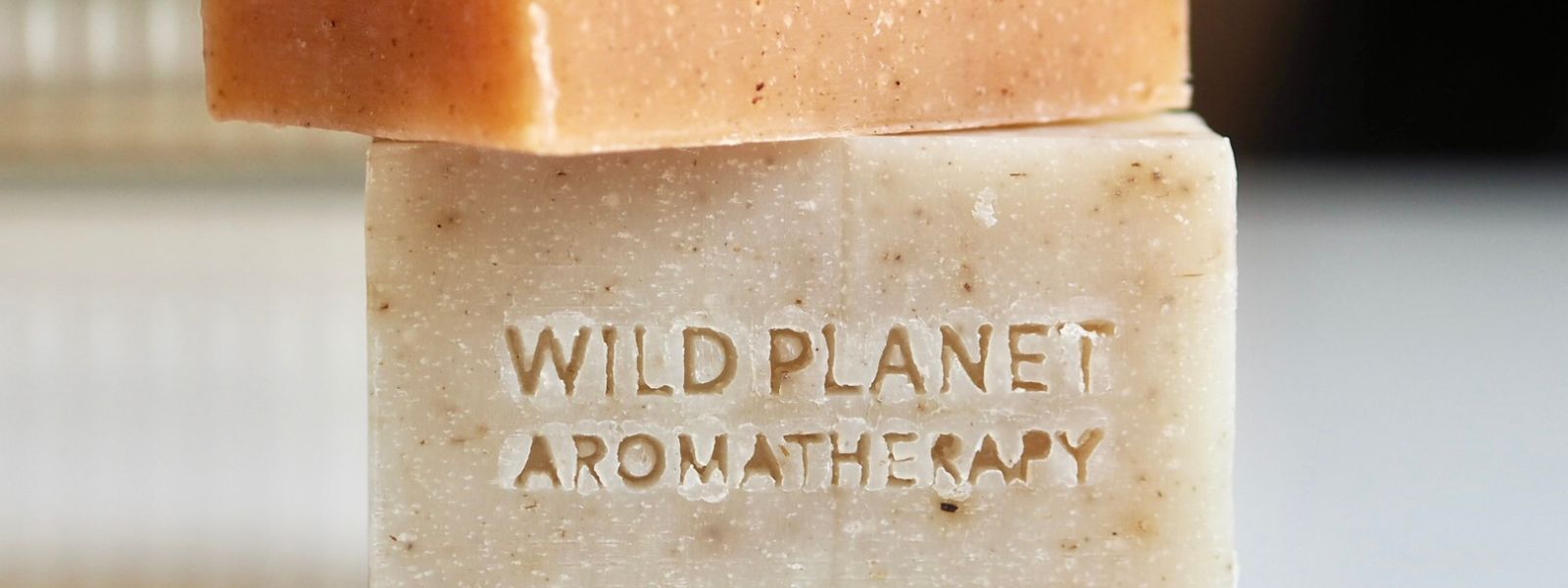 Natural soap bars by Wild Planet Aromatherapy on white background