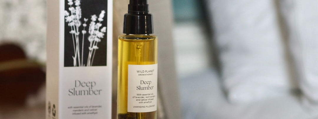 Deep Slumber Pillow Mist and box next to bed