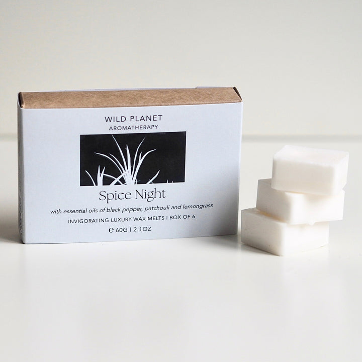 Wild Planet sustainable vegan soy wax melts with essential oils next to natural eco friendly box.