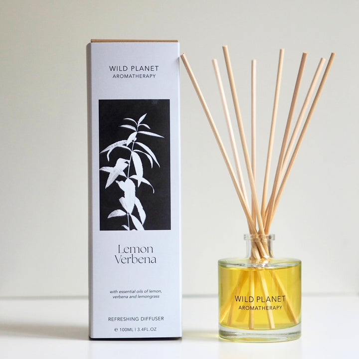 Wild Planet Aromatherapy natural reed diffuser with essential oils next to natural eco friendly box.