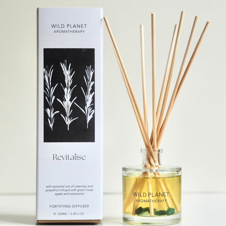 Wild Planet Aromatherapy natural reed diffuser with essential oils next to natural eco friendly box.