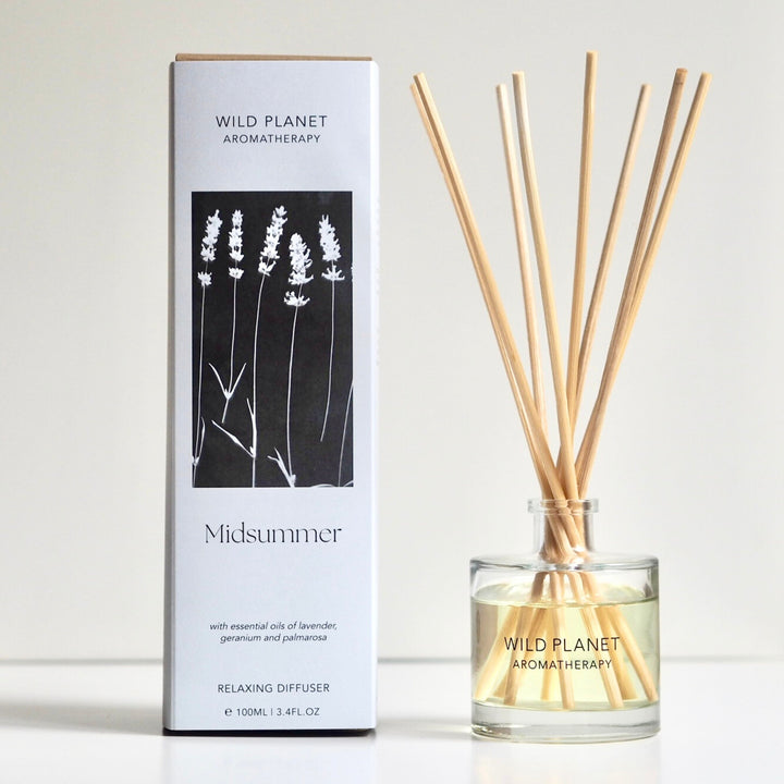 Wild Planet Aromatherapy natural reed diffuser with essential oils next to natural eco friendly box.