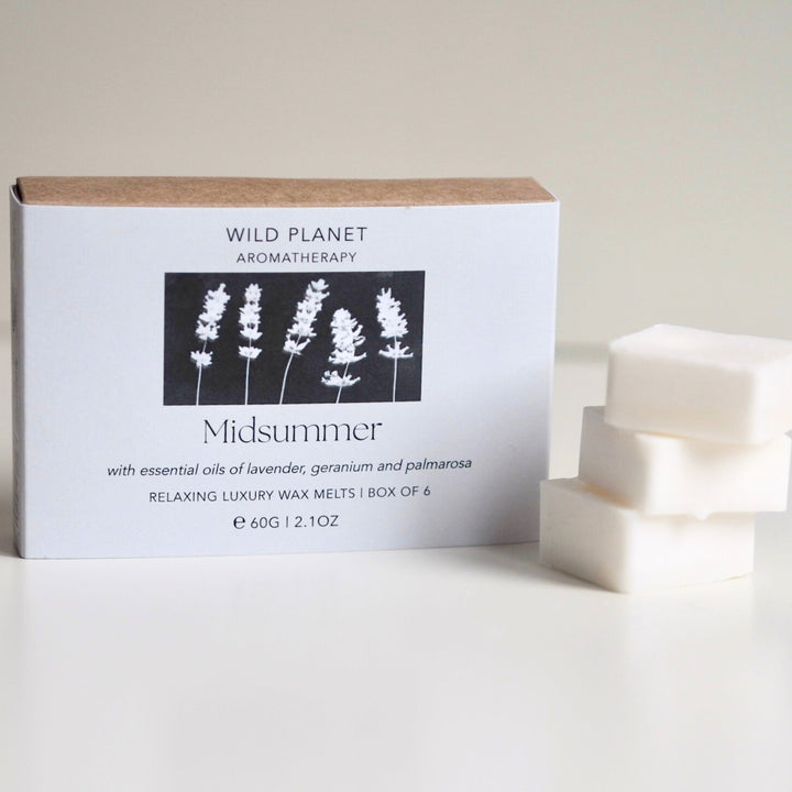 Wild Planet sustainable vegan soy wax melts with essential oils next to natural eco friendly box.