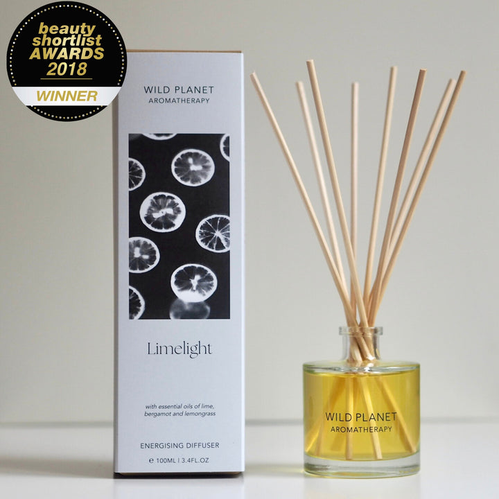 Wild Planet Aromatherapy natural reed diffuser with essential oils next to natural eco friendly box.