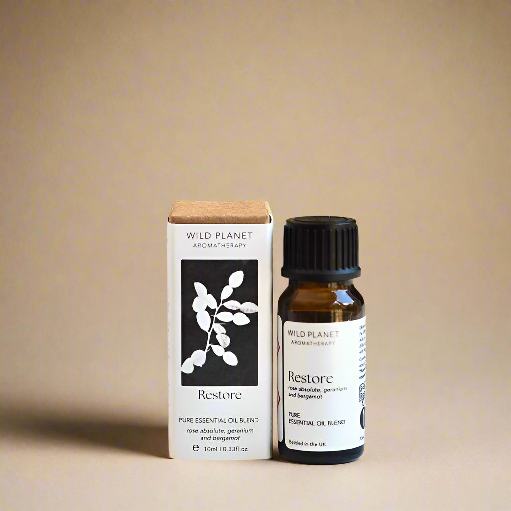 Wild Planet Aromatherapy Restore essential oil blend bottle and box with branding of cyanotype wrap