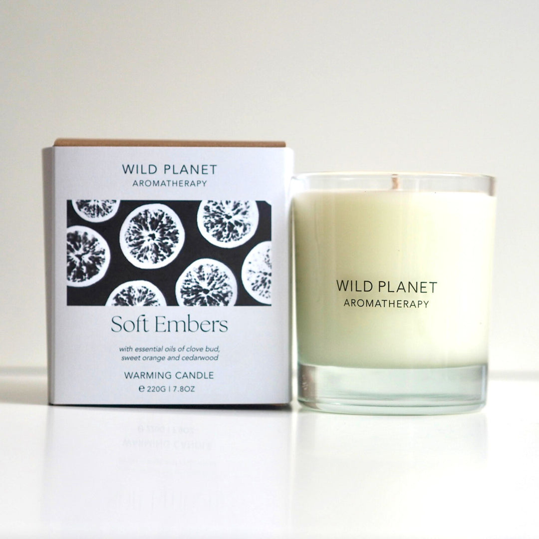Soft Embers Clove and Orange Aromatherapy Candle with branded gift box by Wild Planet Aromatherapy on a clean white background